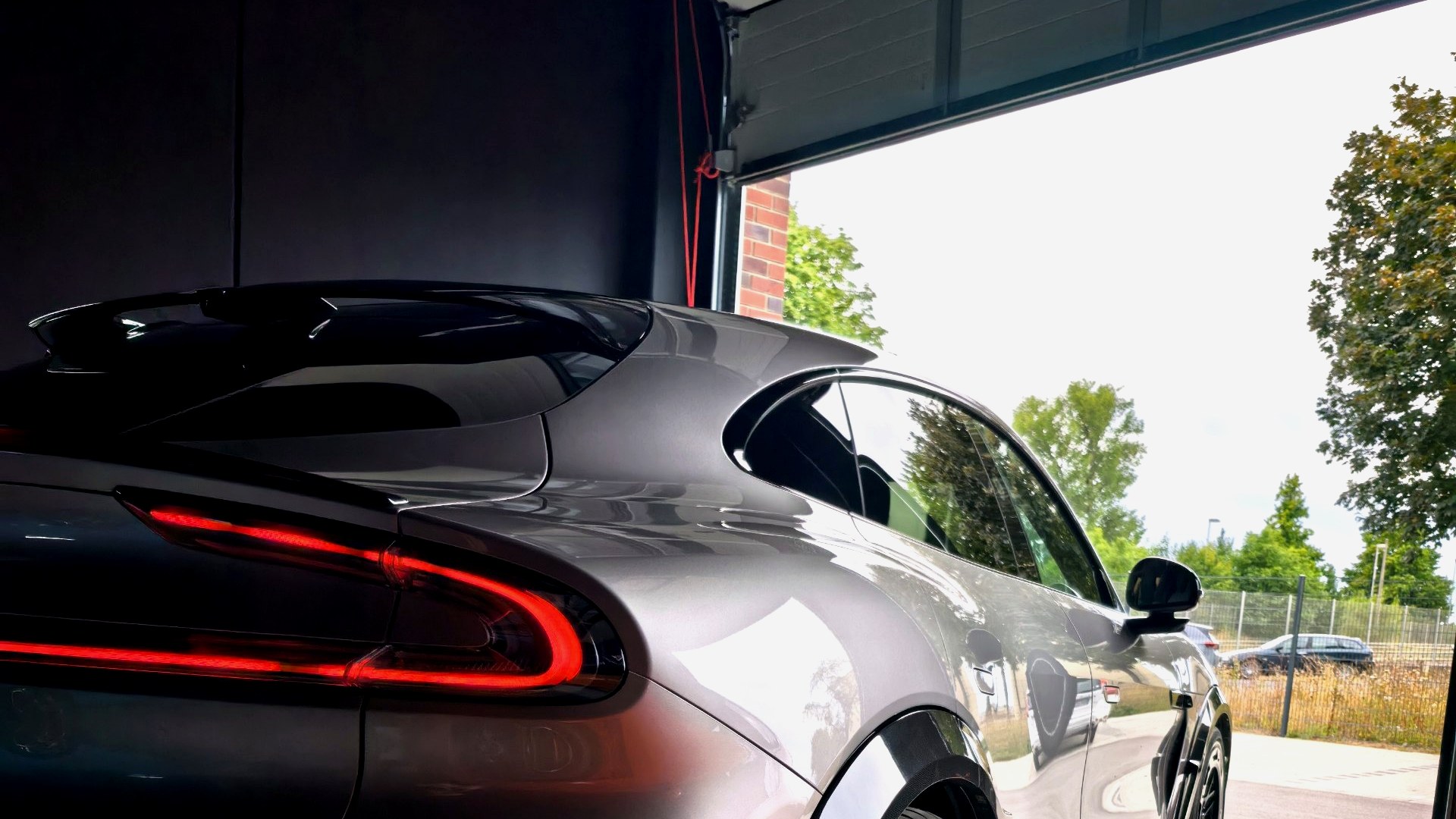 Xiaomi YU7 Max rear three-quarter with JP Performance kit, leaving the garage